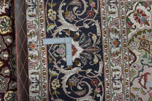 Backside of handmade New Tabriz 50/60/70 Raj rug showing knot structure and weave density
