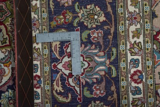 Backside of handmade New Tabriz 50/60/70 Raj rug showing knot structure and weave density