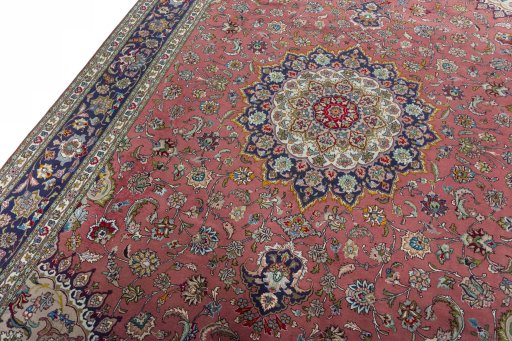 Backside of handmade New Tabriz 50/60/70 Raj rug showing knot structure and weave density