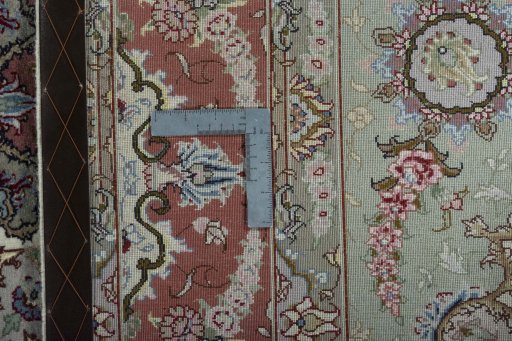 Backside of handmade New Tabriz 50/60/70 Raj rug showing knot structure and weave density