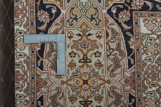 Backside of handmade New Tabriz 50/60/70 Raj rug showing knot structure and weave density
