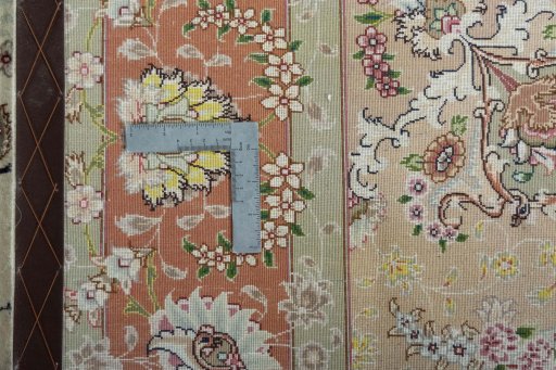 Backside of handmade New Tabriz 50/60/70 Raj rug showing knot structure and weave density