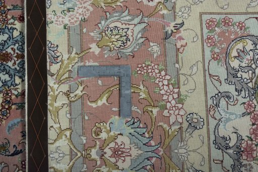 Backside of handmade New Tabriz 50/60/70 Raj rug showing knot structure and weave density