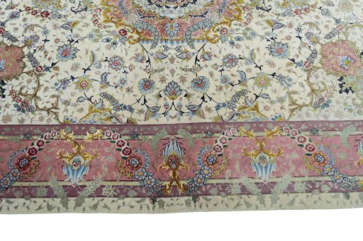 Corner detail of 2000s Tabriz 50/60/70 Raj rug showing border pattern and Cork pile