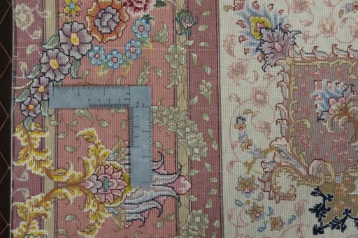 Backside of handmade 2000s Tabriz 50/60/70 Raj rug showing knot structure and weave density