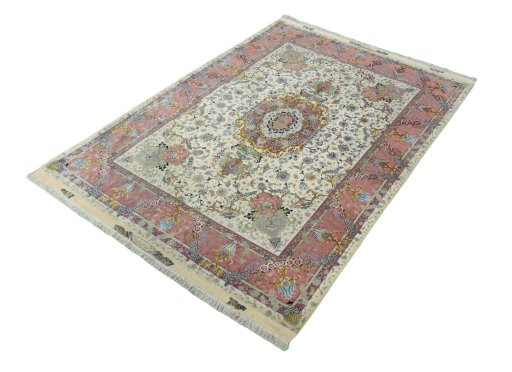 Corner detail of 2000s Tabriz 50/60/70 Raj rug showing border pattern and Cork pile