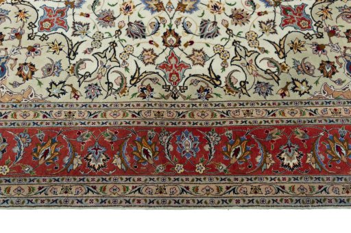Corner detail of 2000s Tabriz 50/60/70 Raj rug showing border pattern and Cork pile