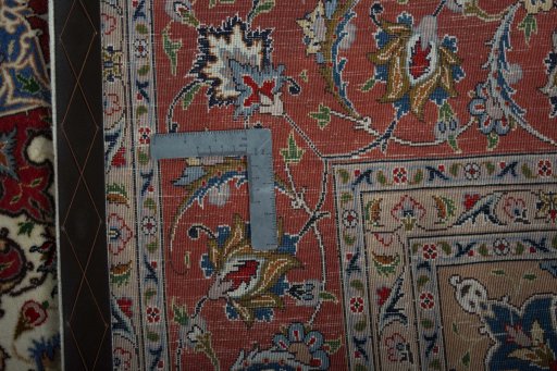 Backside of handmade 2000s Tabriz 50/60/70 Raj rug showing knot structure and weave density
