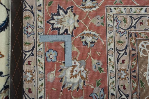 Backside of handmade 2000s Tabriz 50/60/70 Raj rug showing knot structure and weave density