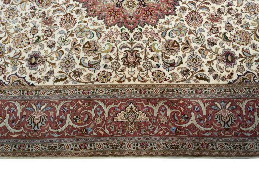 Corner detail of 2000s Tabriz 50/60/70 Raj rug showing border pattern and Cork pile
