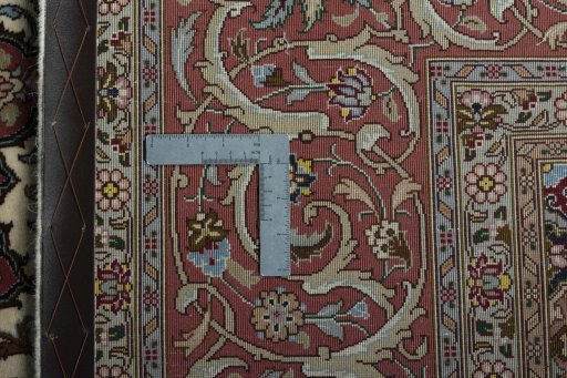Backside of handmade 2000s Tabriz 50/60/70 Raj rug showing knot structure and weave density