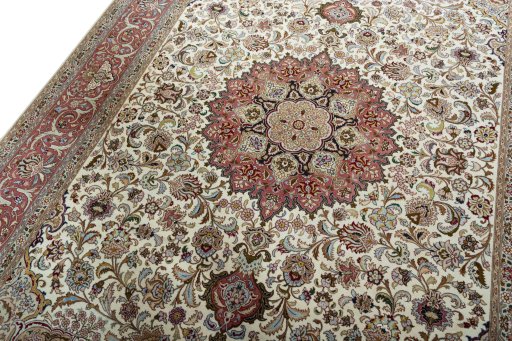 Backside of handmade 2000s Tabriz 50/60/70 Raj rug showing knot structure and weave density