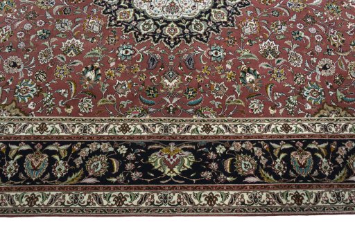 Corner detail of 2000s Tabriz 50/60/70 Raj rug showing border pattern and Cork pile