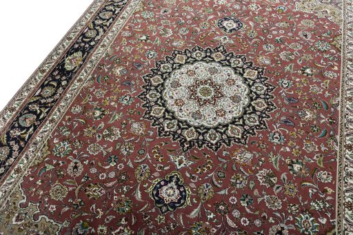 Backside of handmade 2000s Tabriz 50/60/70 Raj rug showing knot structure and weave density