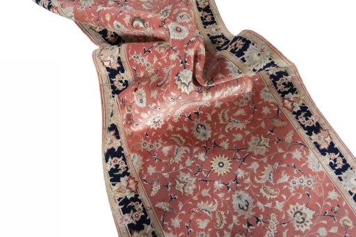 Corner detail of 2000s Tabriz 50/60/70 Raj rug showing border pattern and Cork pile