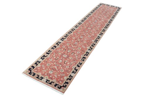 Corner detail of 2000s Tabriz 50/60/70 Raj rug showing border pattern and Cork pile