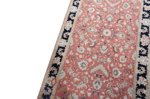 Backside of handmade 2000s Tabriz 50/60/70 Raj rug showing knot structure and weave density
