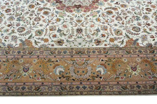 Corner detail of 2000s Tabriz 50/60/70 Raj rug showing border pattern and Cork pile