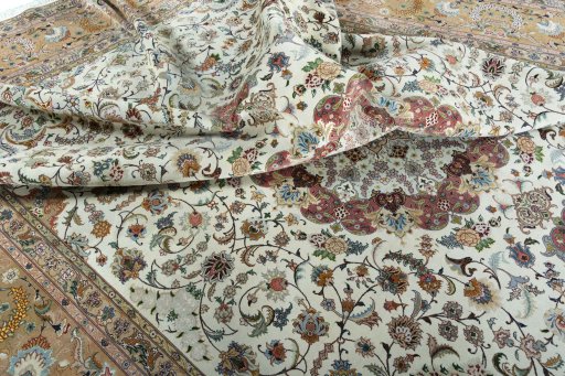 Backside of handmade 2000s Tabriz 50/60/70 Raj rug showing knot structure and weave density