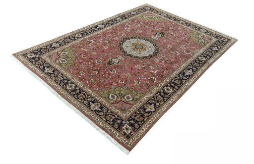 Corner detail of 2000s Tabriz 50/60/70 Raj rug showing border pattern and Cork pile