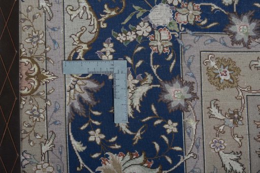Backside of handmade 2000s Tabriz 50/60/70 Raj rug showing knot structure and weave density