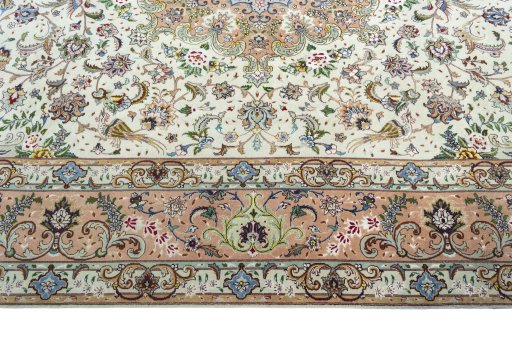 Corner detail of 2000s Tabriz 50/60/70 Raj rug showing border pattern and Cork pile