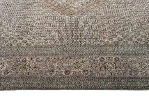 Corner detail of 2000s Tabriz 50/60/70 Raj rug showing border pattern and Cork pile