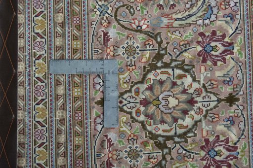 Backside of handmade 2000s Tabriz 50/60/70 Raj rug showing knot structure and weave density