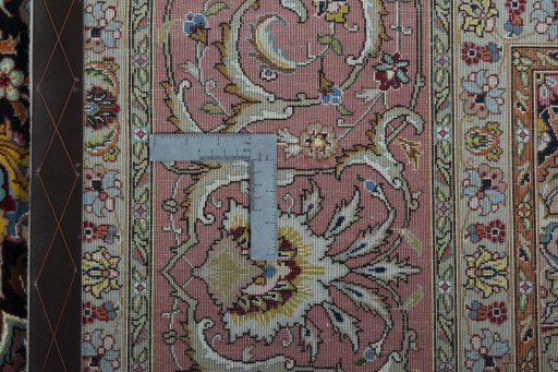 Backside of handmade 2000s Tabriz 50/60/70 Raj rug showing knot structure and weave density