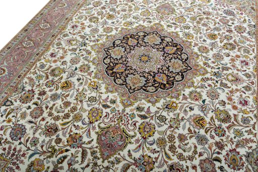 Backside of handmade 2000s Tabriz 50/60/70 Raj rug showing knot structure and weave density