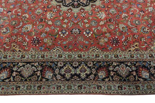 Corner detail of 2000s Tabriz 50/60/70 Raj rug showing border pattern and Cork pile