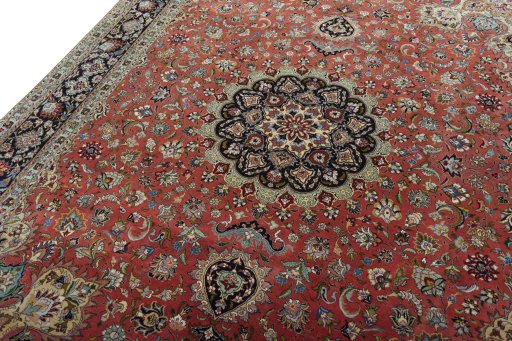 Backside of handmade 2000s Tabriz 50/60/70 Raj rug showing knot structure and weave density