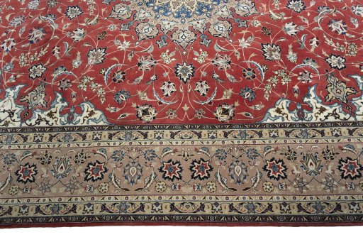 Corner detail of 2000s Tabriz 50/60/70 Raj rug showing border pattern and Cork pile