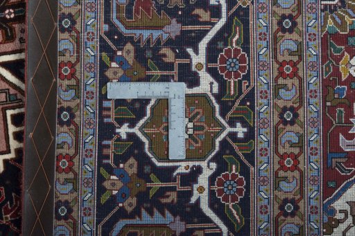 Backside of handmade 2000s Tabriz 50/60/70 Raj rug showing knot structure and weave density