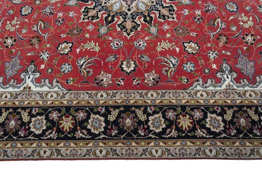 Corner detail of 2000s Tabriz 50/60/70 Raj rug showing border pattern and Cork pile
