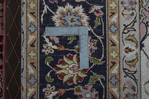 Backside of handmade 2000s Tabriz 50/60/70 Raj rug showing knot structure and weave density