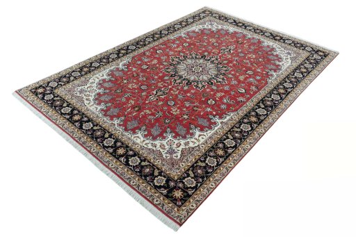 Corner detail of 2000s Tabriz 50/60/70 Raj rug showing border pattern and Cork pile