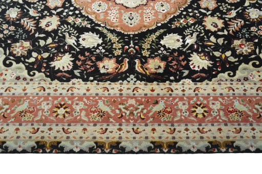 Corner detail of 2000s Tabriz 50/60/70 Raj rug showing border pattern and Cork pile