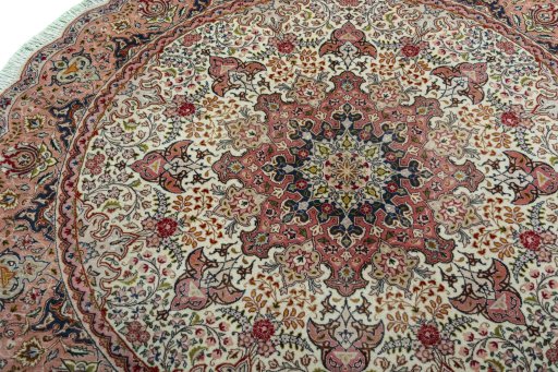 Backside of handmade New Tabriz 50/60/70 Raj rug showing knot structure and weave density