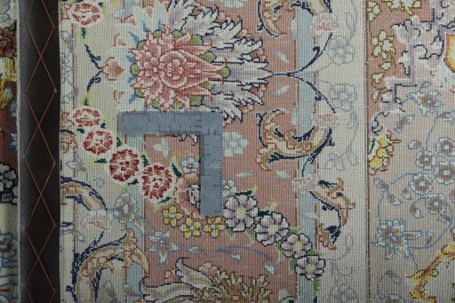 Backside of handmade 2000s Tabriz 50/60/70 Raj rug showing knot structure and weave density
