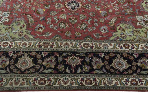 Corner detail of 2000s Tabriz 50/60/70 Raj rug showing border pattern and Cork pile