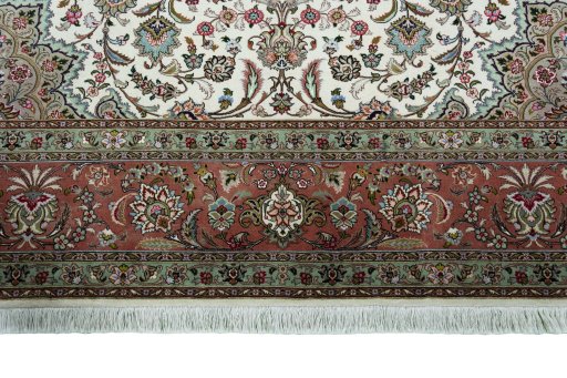 Corner detail of 2000s Tabriz 50/60/70 Raj rug showing border pattern and Cork pile