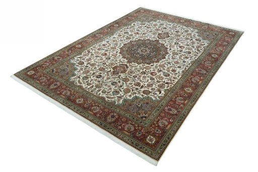 Corner detail of 2000s Tabriz 50/60/70 Raj rug showing border pattern and Cork pile