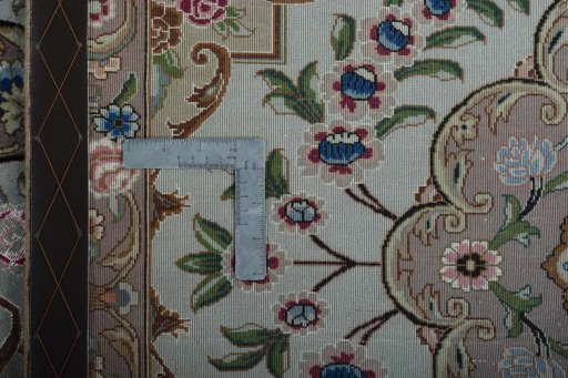 Surface texture of 2000s Tabriz 50/60/70 Raj rug with natural Cork and intricate pattern