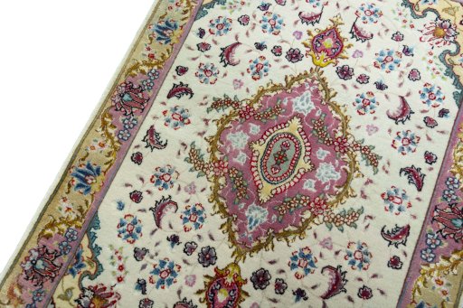 Backside of handmade 2000s Tabriz 50/60/70 Raj rug showing knot structure and weave density