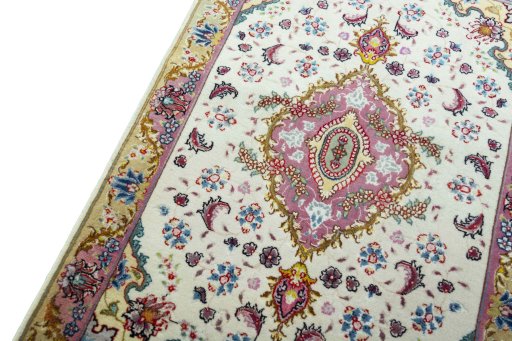 Backside of handmade 2000s Tabriz 50/60/70 Raj rug showing knot structure and weave density