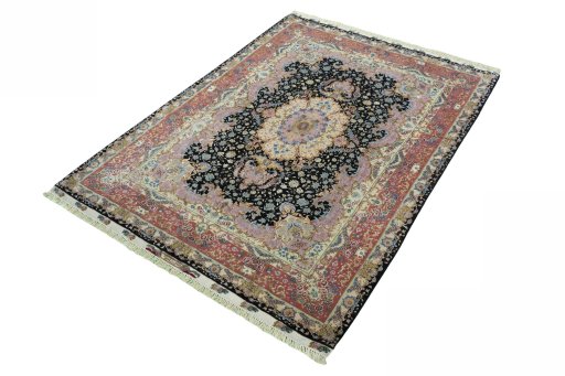 Corner detail of 2000s Tabriz 50/60/70 Raj rug showing border pattern and Cork pile