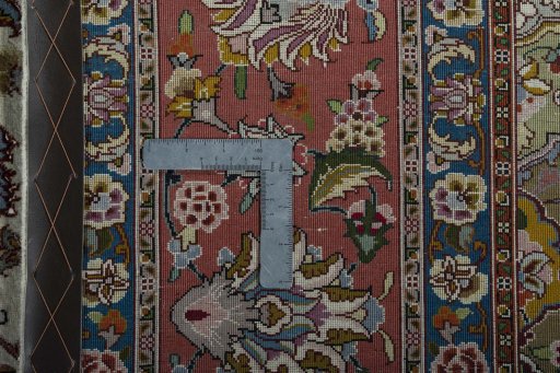 Backside of handmade New Tabriz 50/60/70 Raj rug showing knot structure and weave density