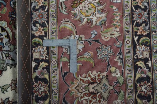 Backside of handmade New Tabriz 50/60/70 Raj rug showing knot structure and weave density