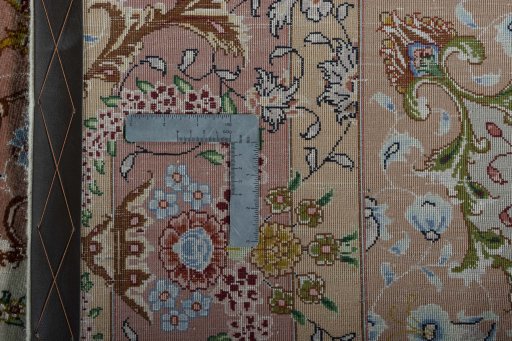 Backside of handmade New Tabriz 50/60/70 Raj rug showing knot structure and weave density